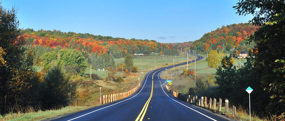 Winding rural road with fall scenery