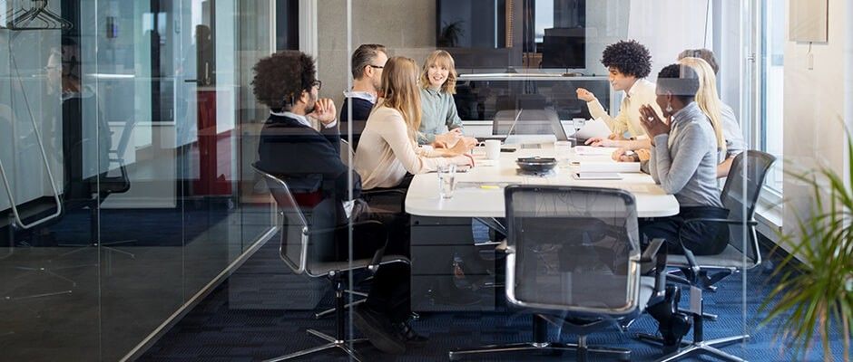Business people having a board meeting in a modern office setting
